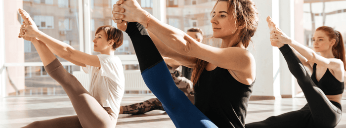Group of women performing yoga